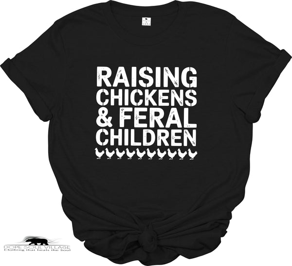 Black t-shirt with white text 'RAISING CHICKENS & FERAL CHILDREN' on a white background