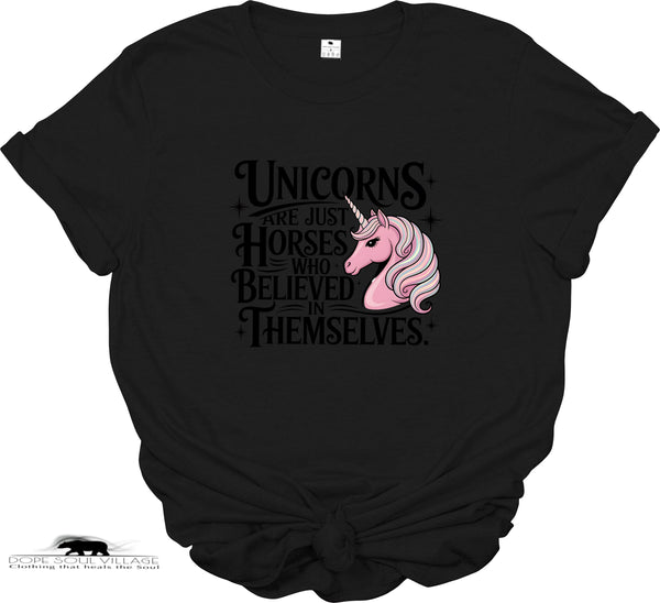 Black t-shirt with a pink unicorn graphic and text on a white background