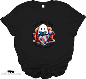 Black t-shirt with a ghost reading a book graphic and text on a white background