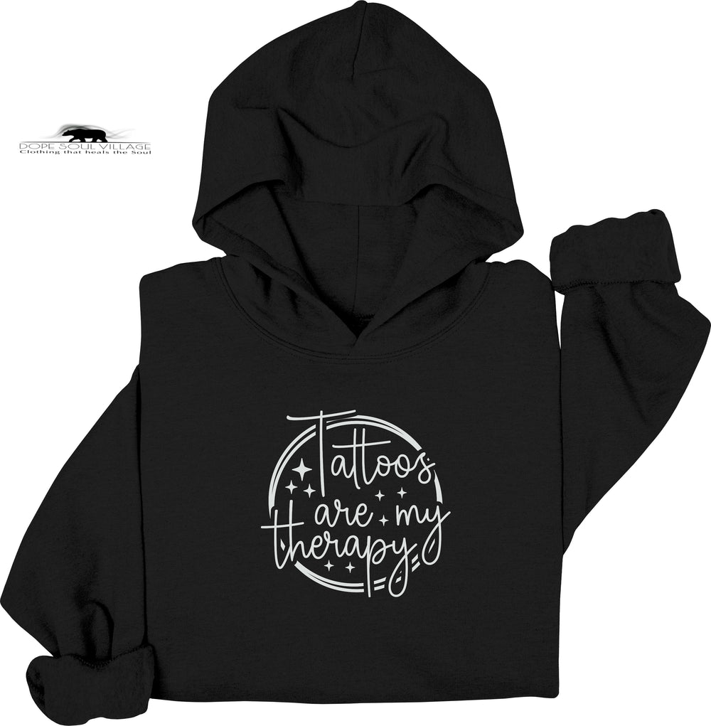 Black hoodie with 'Tattoos are my therapy' text on a white background