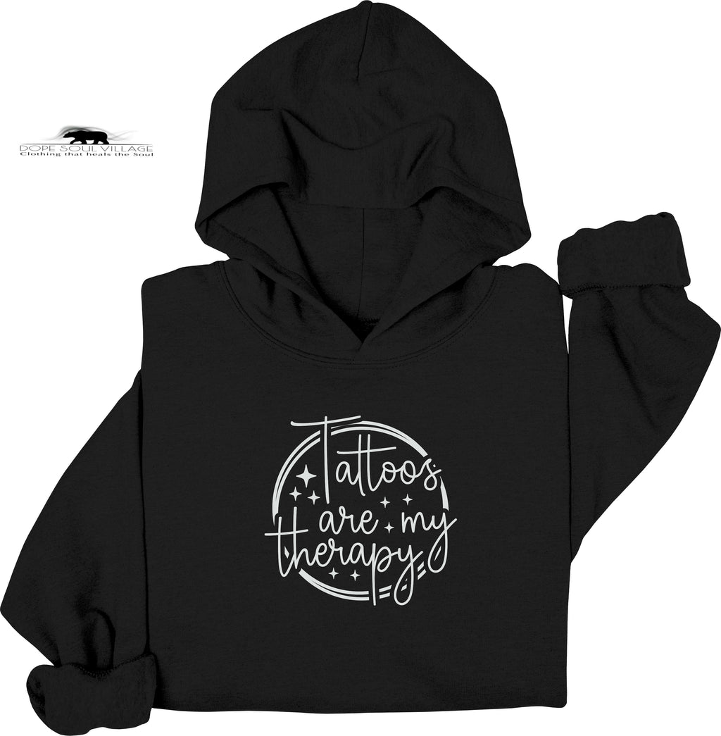 Black hoodie with 'Tattoos are my therapy' text on a white background
