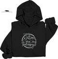 Black hoodie with 'Tattoos are my therapy' text on a white background