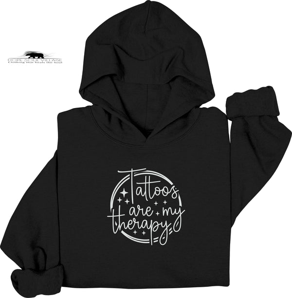 Black hoodie with 'Tattoos are my therapy' text on a white background