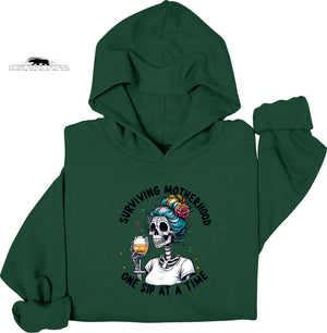 Green hoodie with a skeleton design and text on a white background