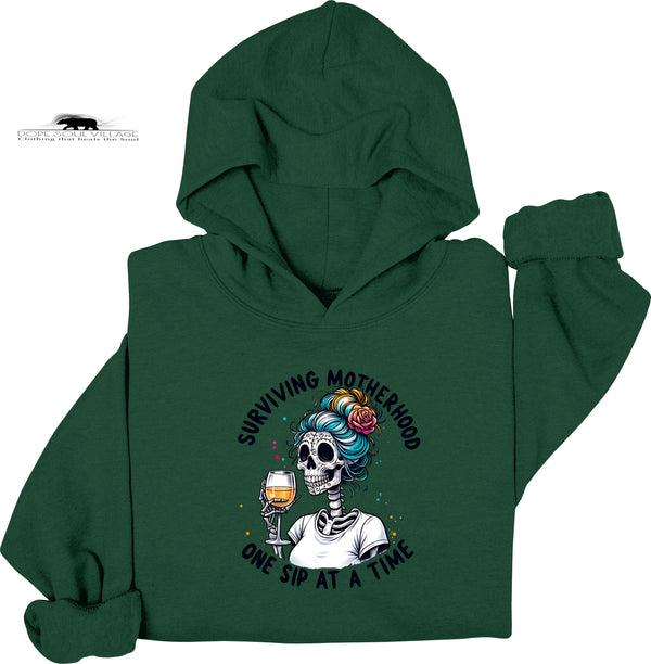 Green hoodie with a skeleton design and text on a white background