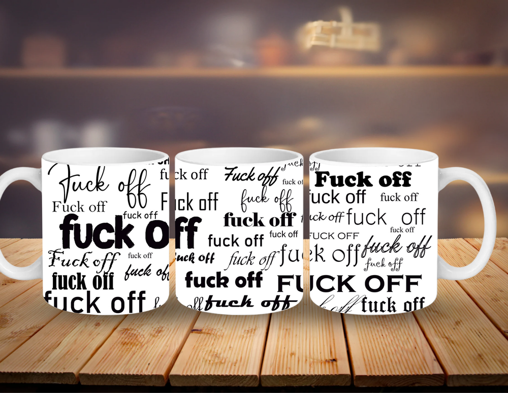 Three white mugs with 'F**K OFF' printed in black on a wooden surface.