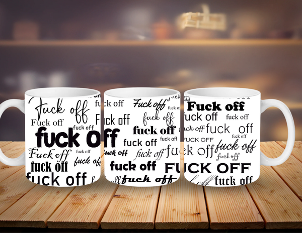 Three white mugs with 'F**K OFF' printed in black on a wooden surface.