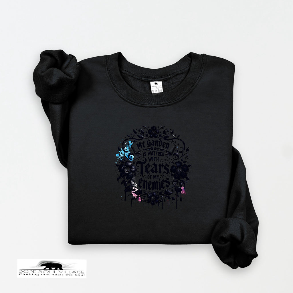 Black sweatshirt with floral design and text on a white background