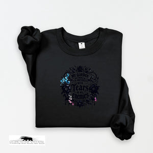 Black sweatshirt with floral design and text on a white background