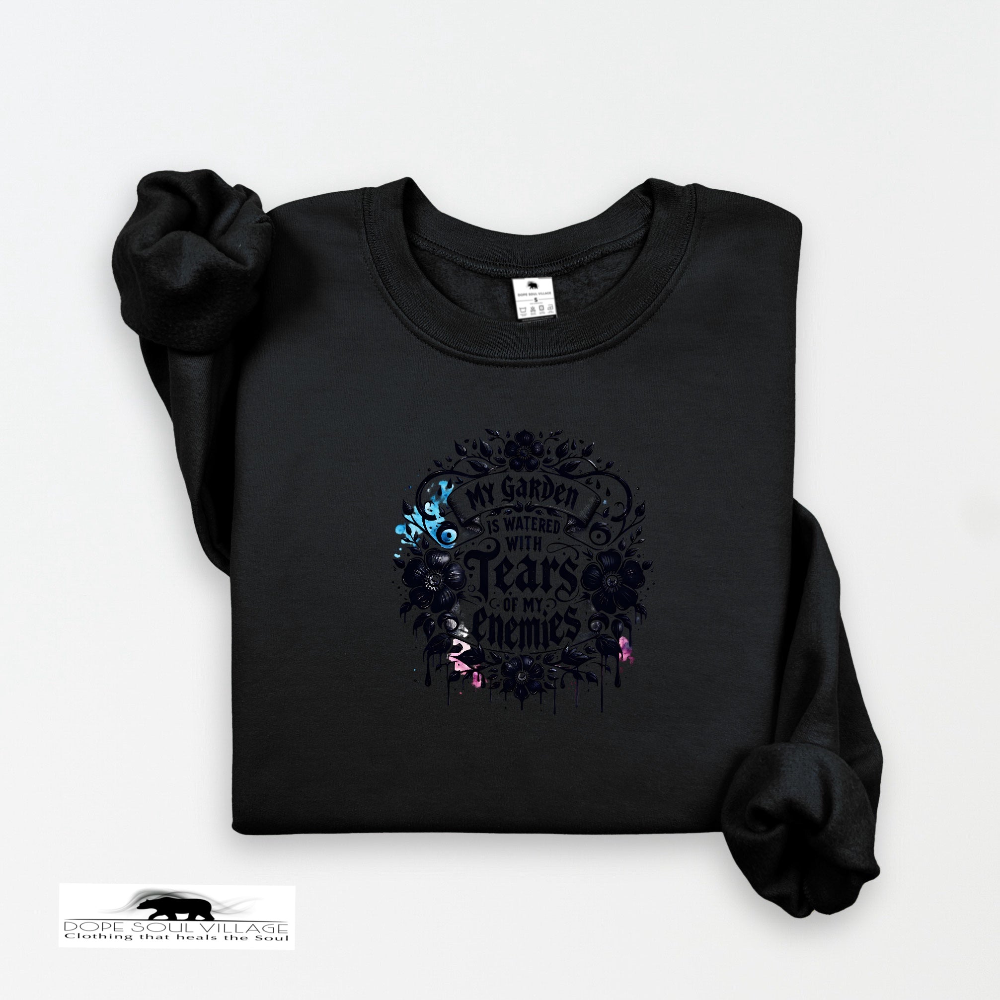 Black sweatshirt with floral design and text on a white background