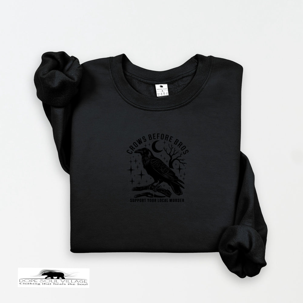 Black sweatshirt with a crow design and text on a white background