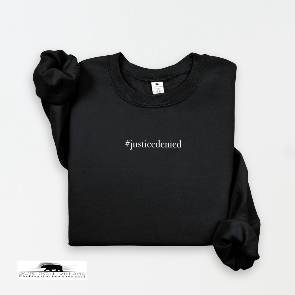 Black sweatshirt with '#justicedenied' text on a white background rebecca goodwin