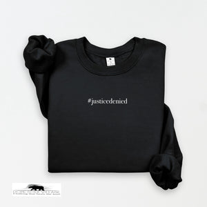 Black sweatshirt with '#justicedenied' text on a white background rebecca goodwin