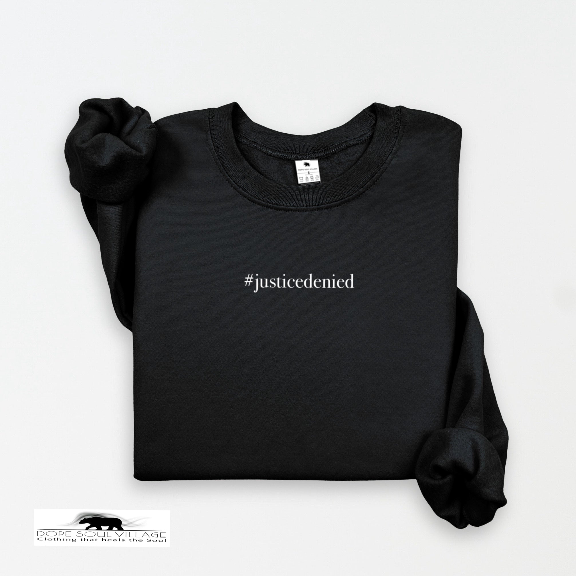 Black sweatshirt with '#justicedenied' text on a white background rebecca goodwin