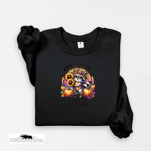 Black sweatshirt with a raccoon and pumpkin design on a white background