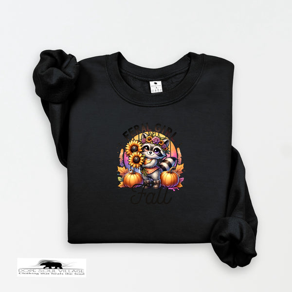 Black sweatshirt with a raccoon and pumpkin design on a white background