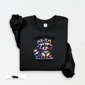 Black sweatshirt with a raccoon graphic and text on a white background