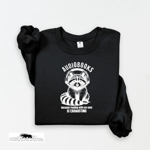 Black sweatshirt with raccoon graphic and text on a white background