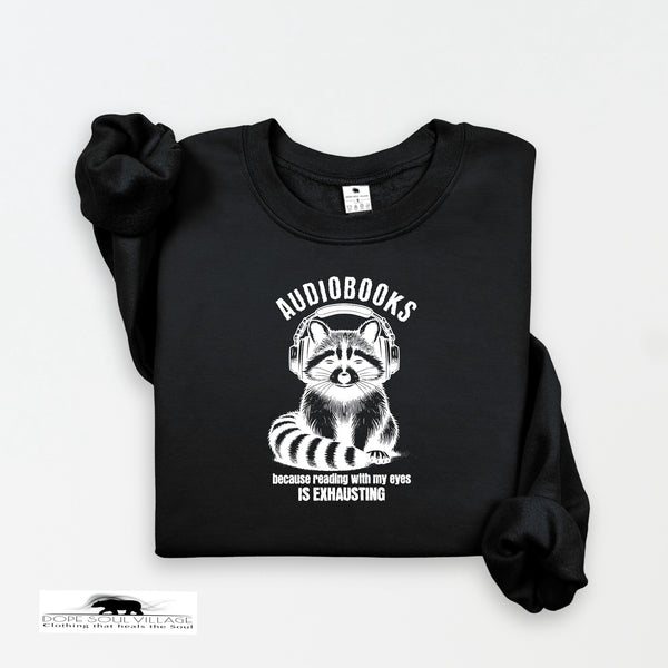 Black sweatshirt with raccoon graphic and text on a white background