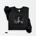 Black sweatshirt with a graphic design on a white background
