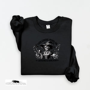 Black sweatshirt with a graphic design on a white background