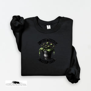 Black sweatshirt with a graphic design on a white background