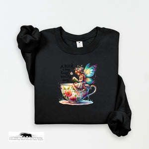 Black sweatshirt with a colorful fairy design and text on a white background