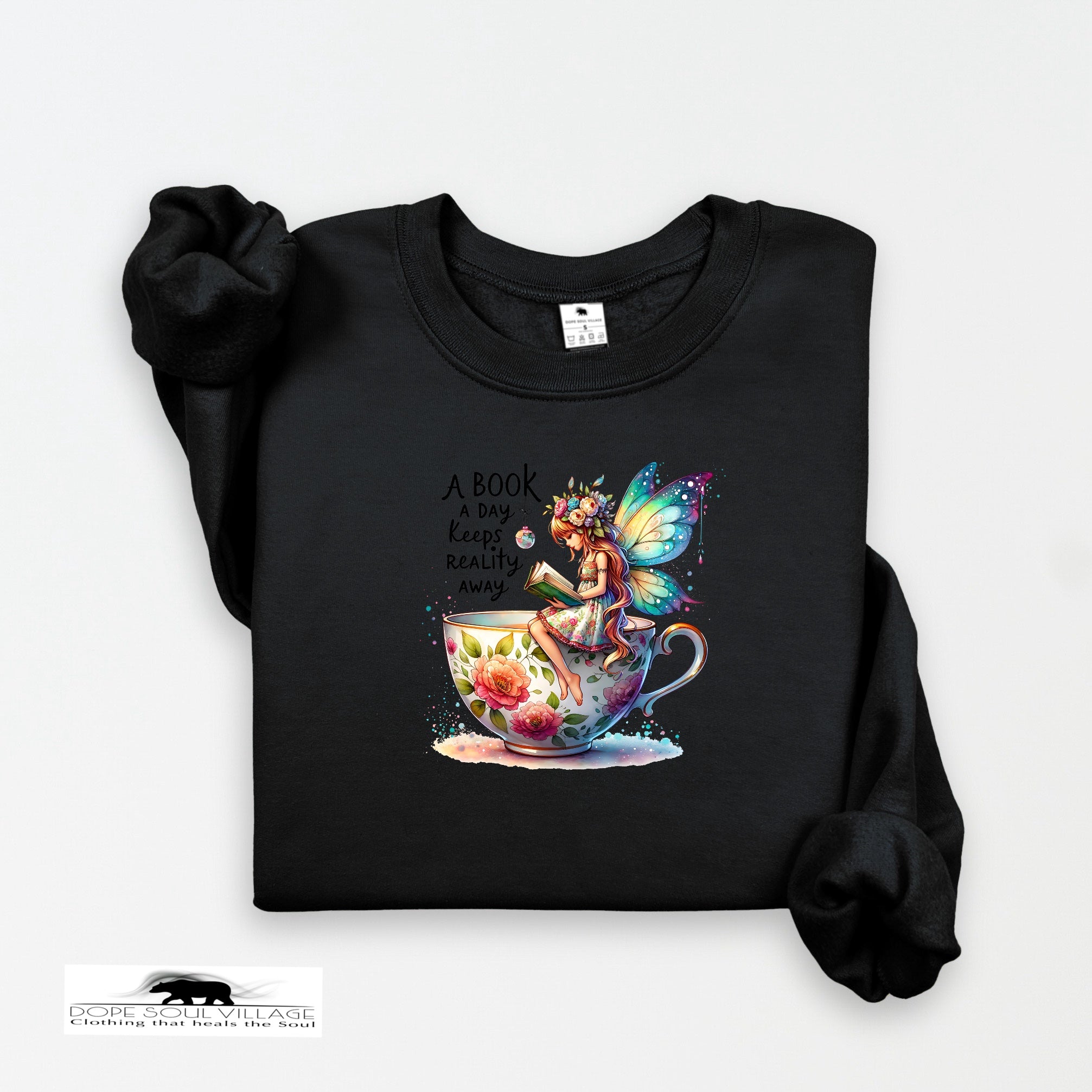 Black sweatshirt with a colorful fairy design and text on a white background