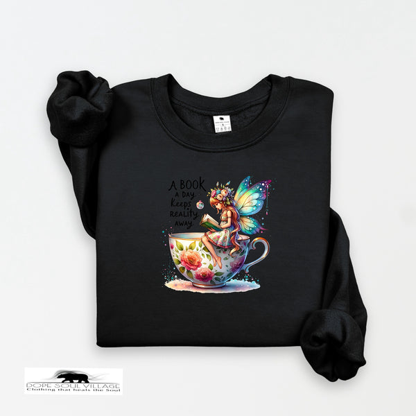 Black sweatshirt with a colorful fairy design and text on a white background