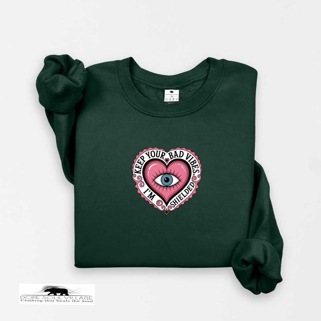Dark green sweatshirt with a pink heart design and text on a white background