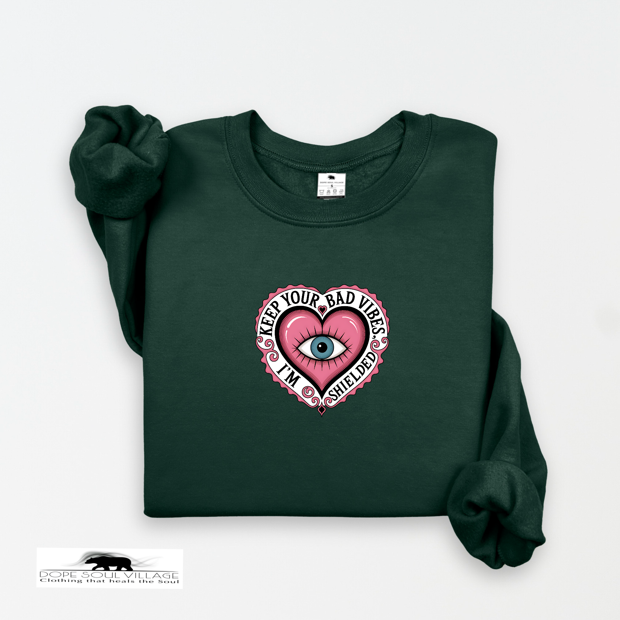 Dark green sweatshirt with a pink heart design and text on a white background