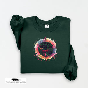 Green sweatshirt with colorful design and text on a white background