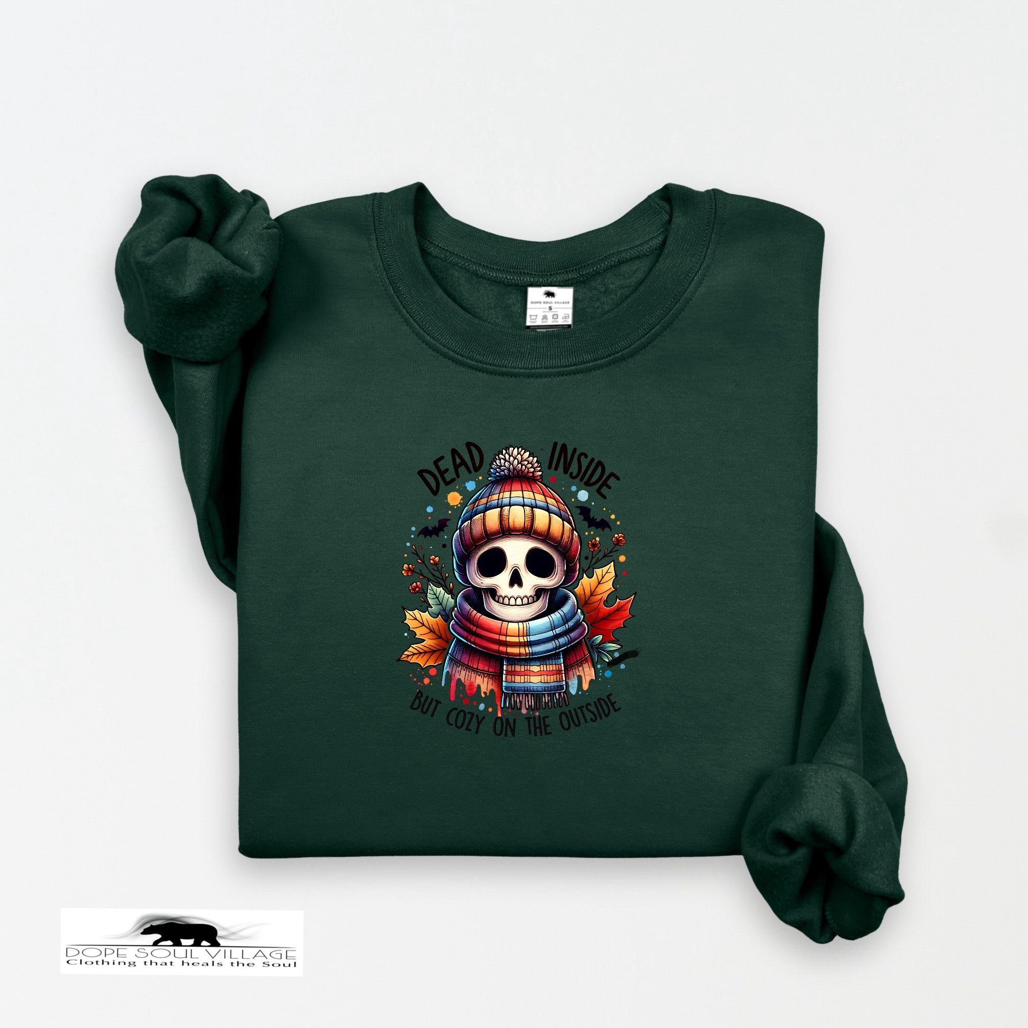 Green sweatshirt with a skull design and text on a white background