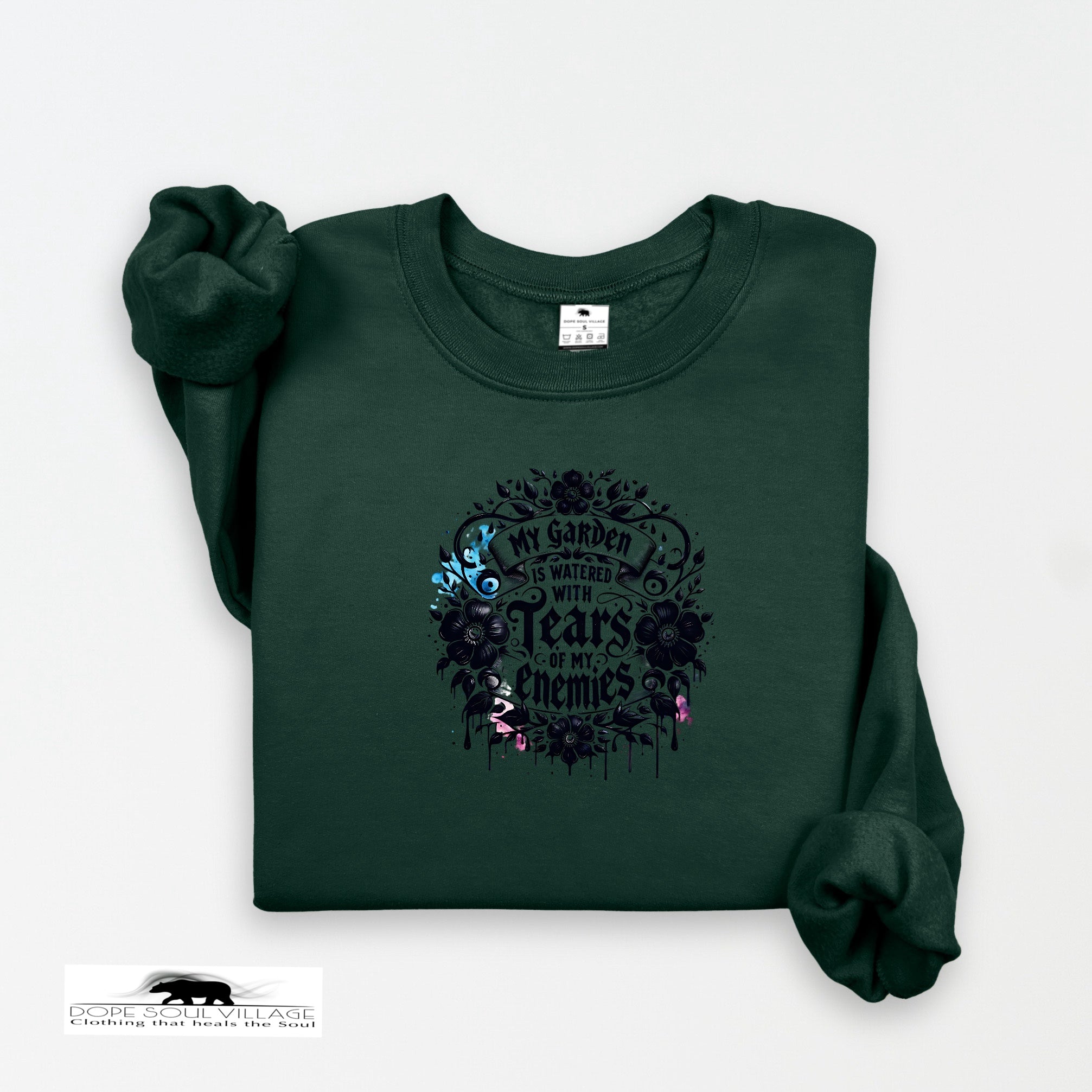 Dark green sweatshirt with floral design and text on a white background