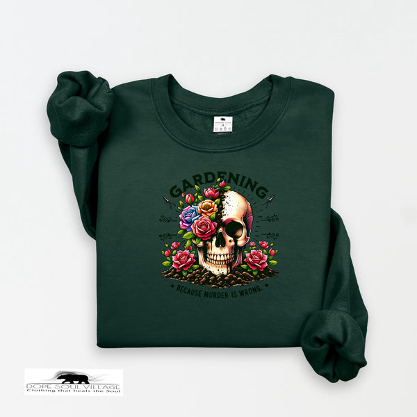 Green sweatshirt with a skull and floral design on a white background