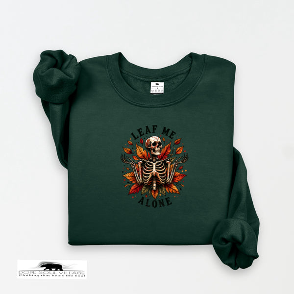 Green sweatshirt with a skeleton and leaf design on a white background