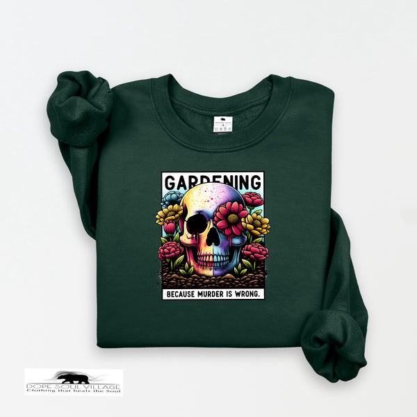 Green sweatshirt with a colorful skull design and text on a white background