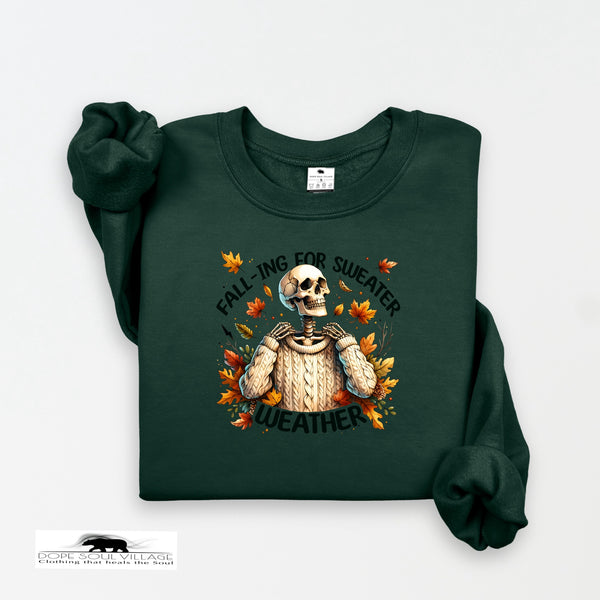 Green sweatshirt with a skeleton and autumn leaves design on a white background