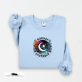 Light blue sweatshirt with a colorful graphic design on a white background