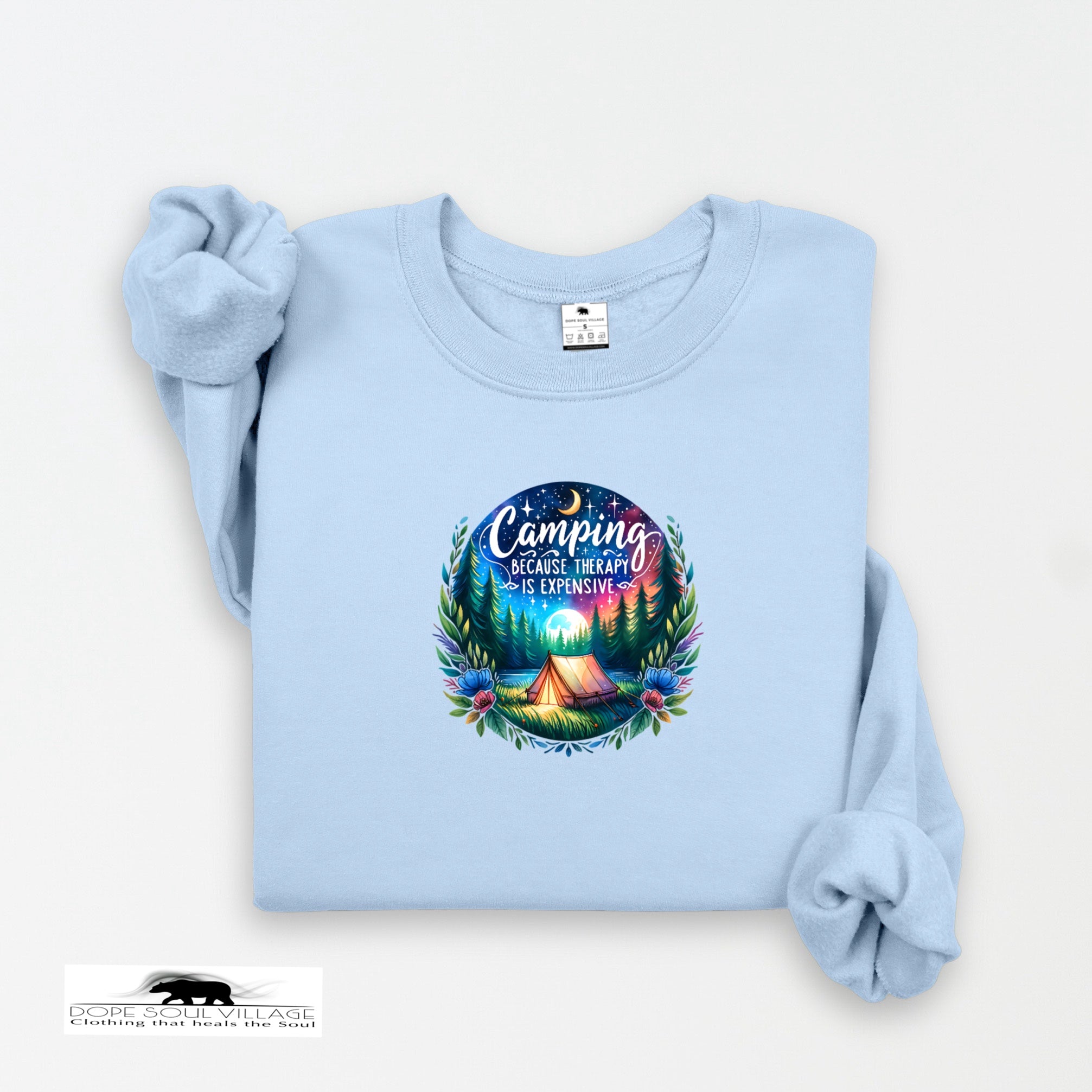 Light blue sweatshirt with a camping graphic and text on a white background