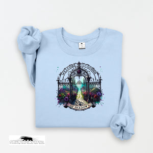 Light blue sweatshirt with a decorative gate design on a white background