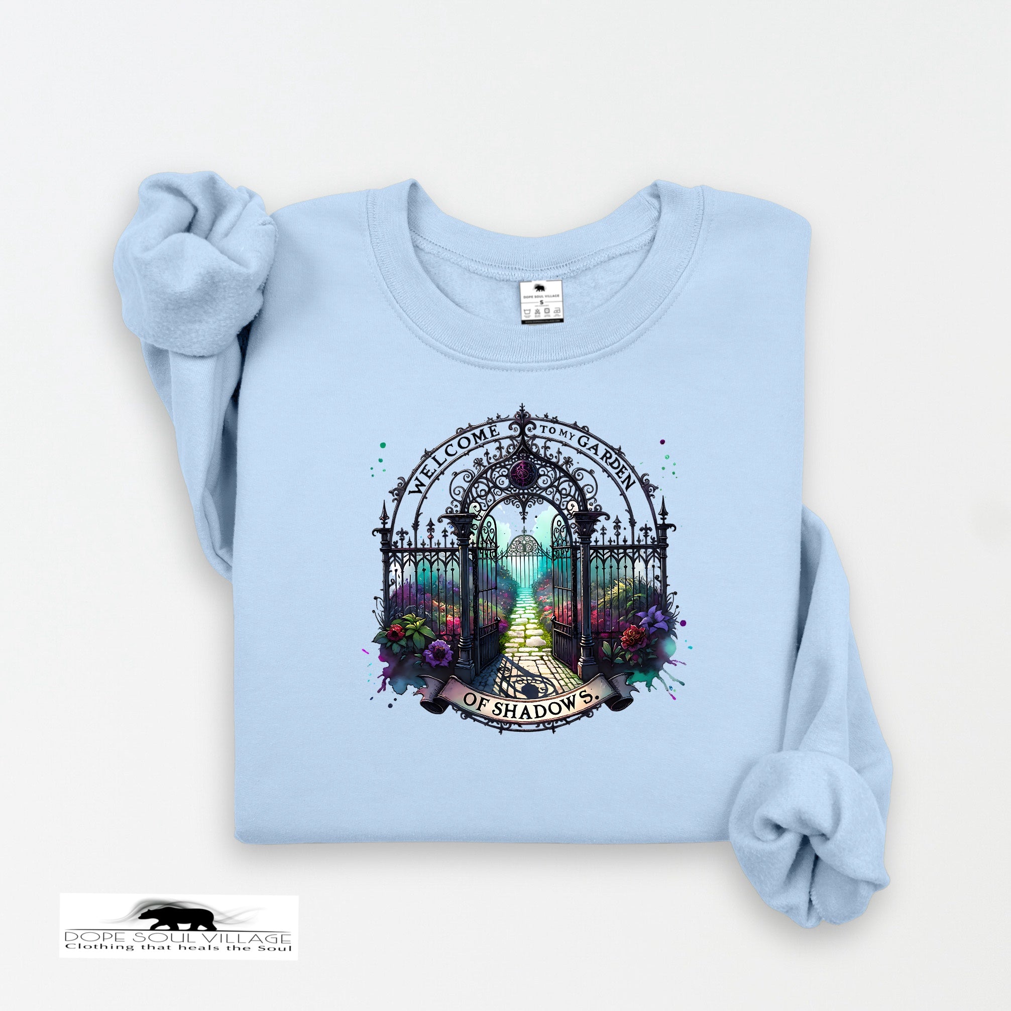 Light blue sweatshirt with a decorative gate design on a white background
