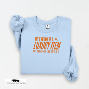 Light blue sweatshirt with orange text on a white background
