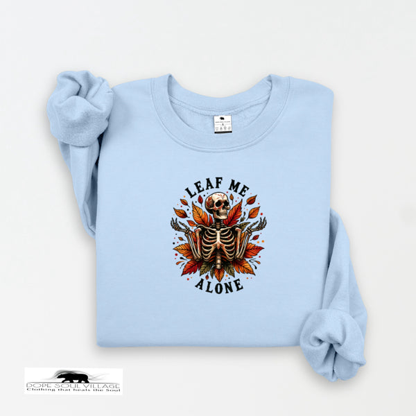 Light blue sweatshirt with skeleton and leaf design on a white background