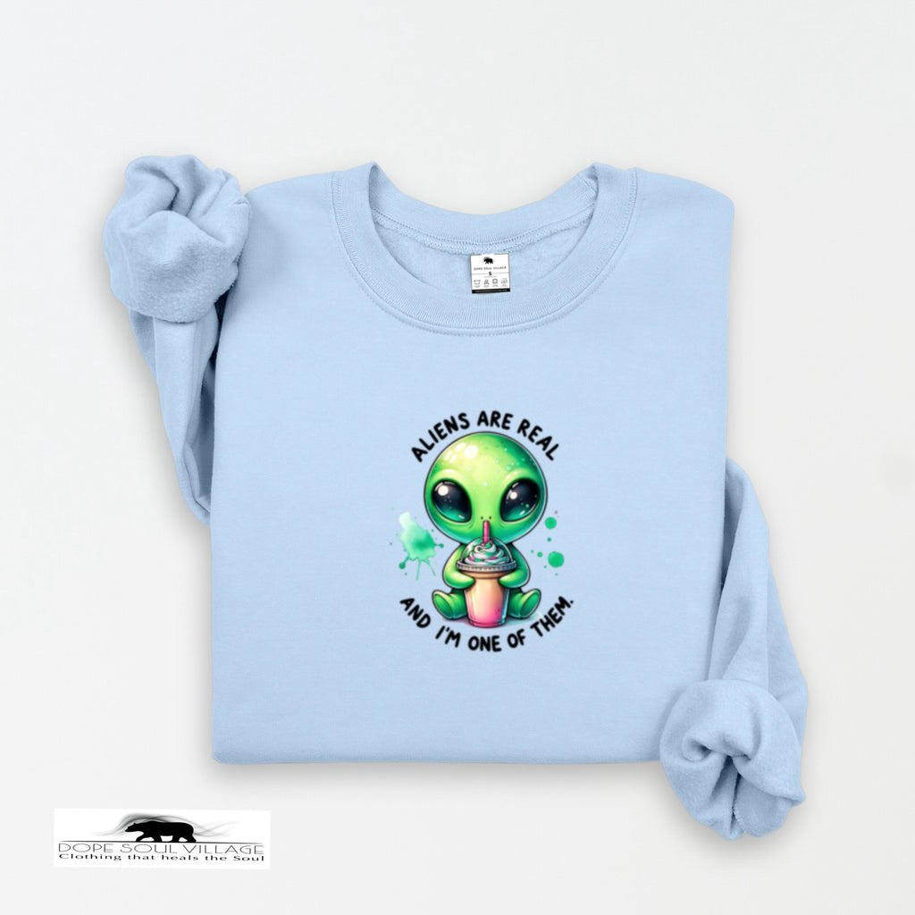 Light blue sweatshirt with a cartoon alien design and text on a white background