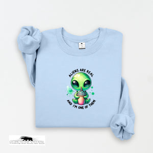 Light blue sweatshirt with a cartoon alien design and text on a white background