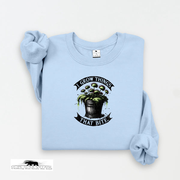 Light blue sweatshirt with graphic design and text on a white background