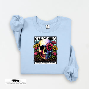 Light blue sweatshirt with a colorful skull design and text on a white background