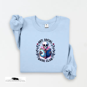 Light blue sweatshirt with a skull and book design on a white background