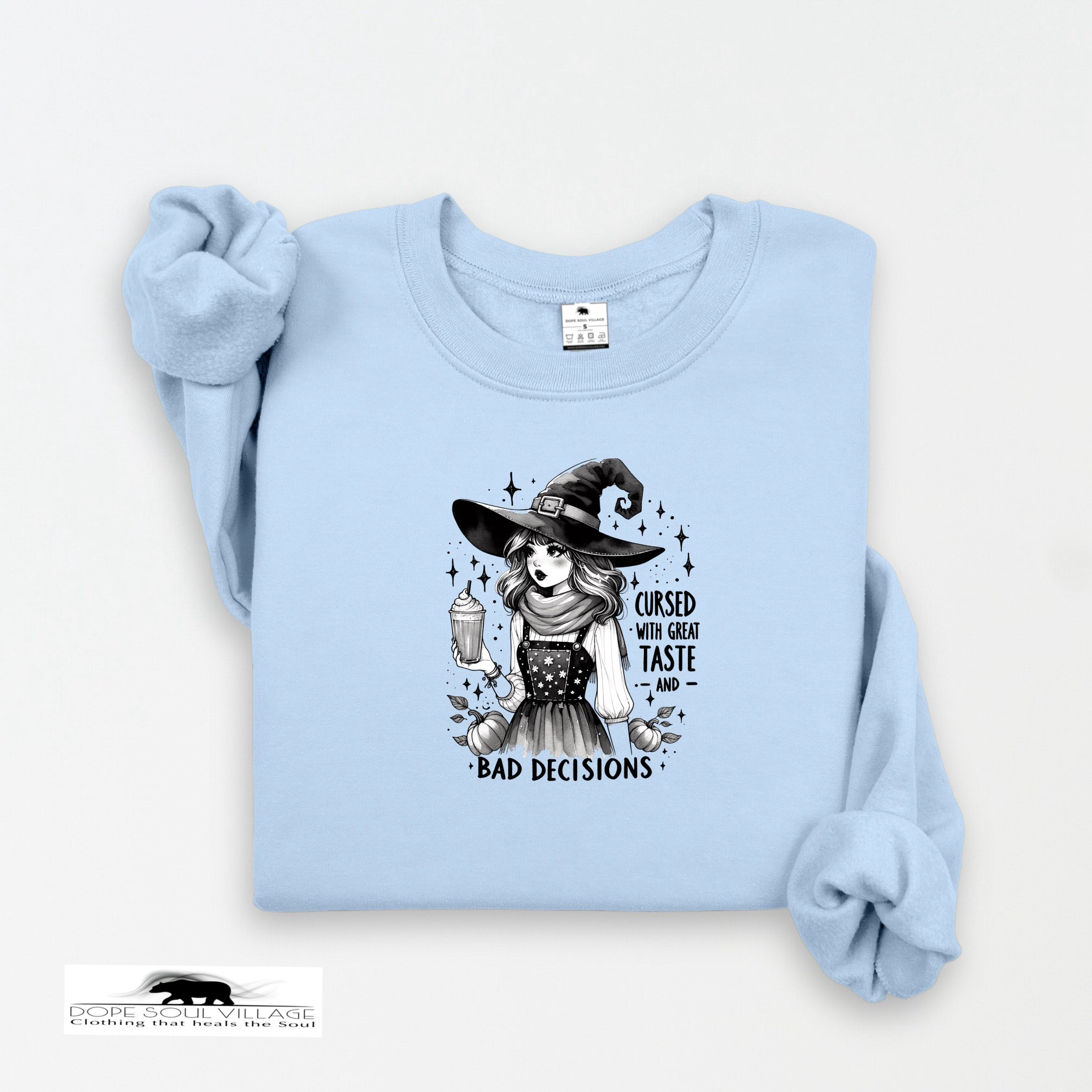 Light blue sweatshirt with a graphic of a witch and text on a white background